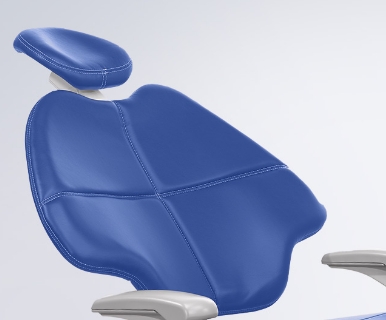 A Pacific blue A-dec 500 dental chair sits on a white background.