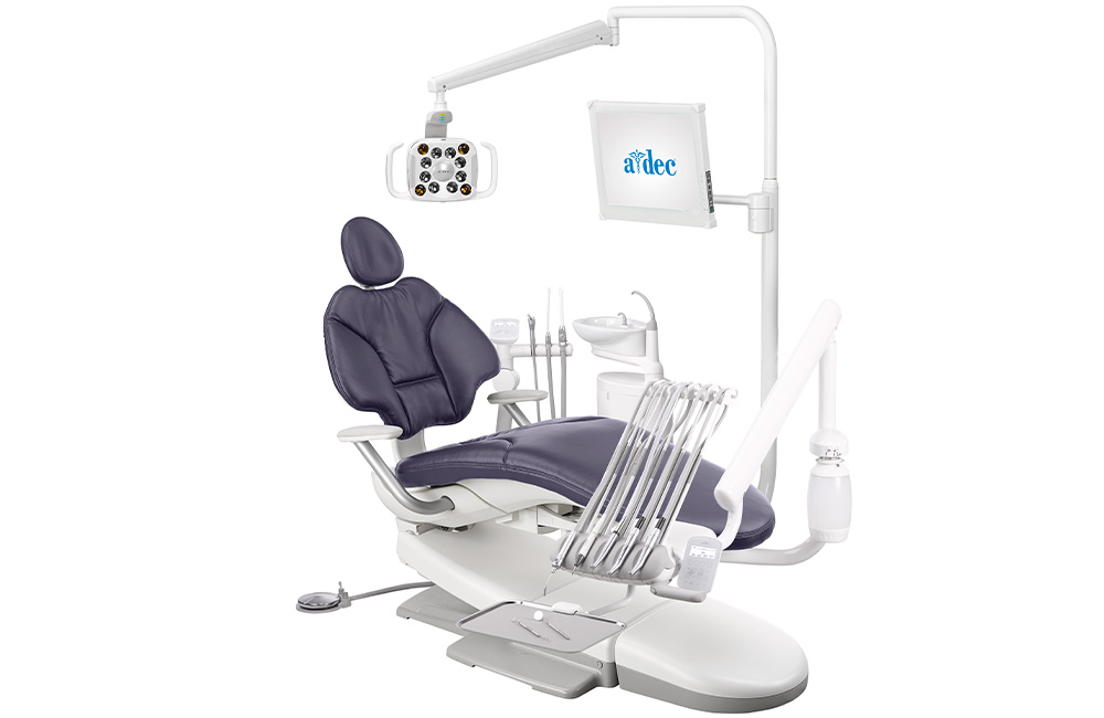 A-dec 400 dental chair with Plum upholstery, cuspidor, and other dental equipment