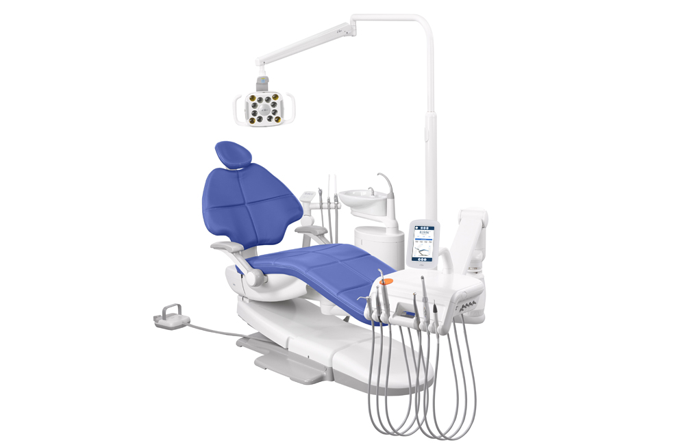 A-dec 500 dental chair with Pacific upholstery, cuspidor, and other dental equipment